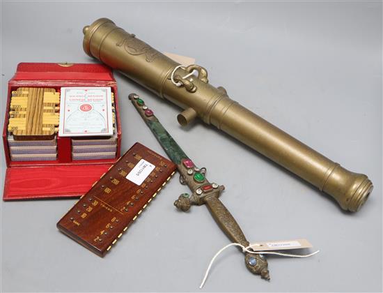 A replica brass cannon, a replica jewelled dagger (a.f), a Klik bridge marker and a cased game of Bezique